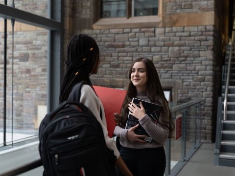 Two students chatting on campus